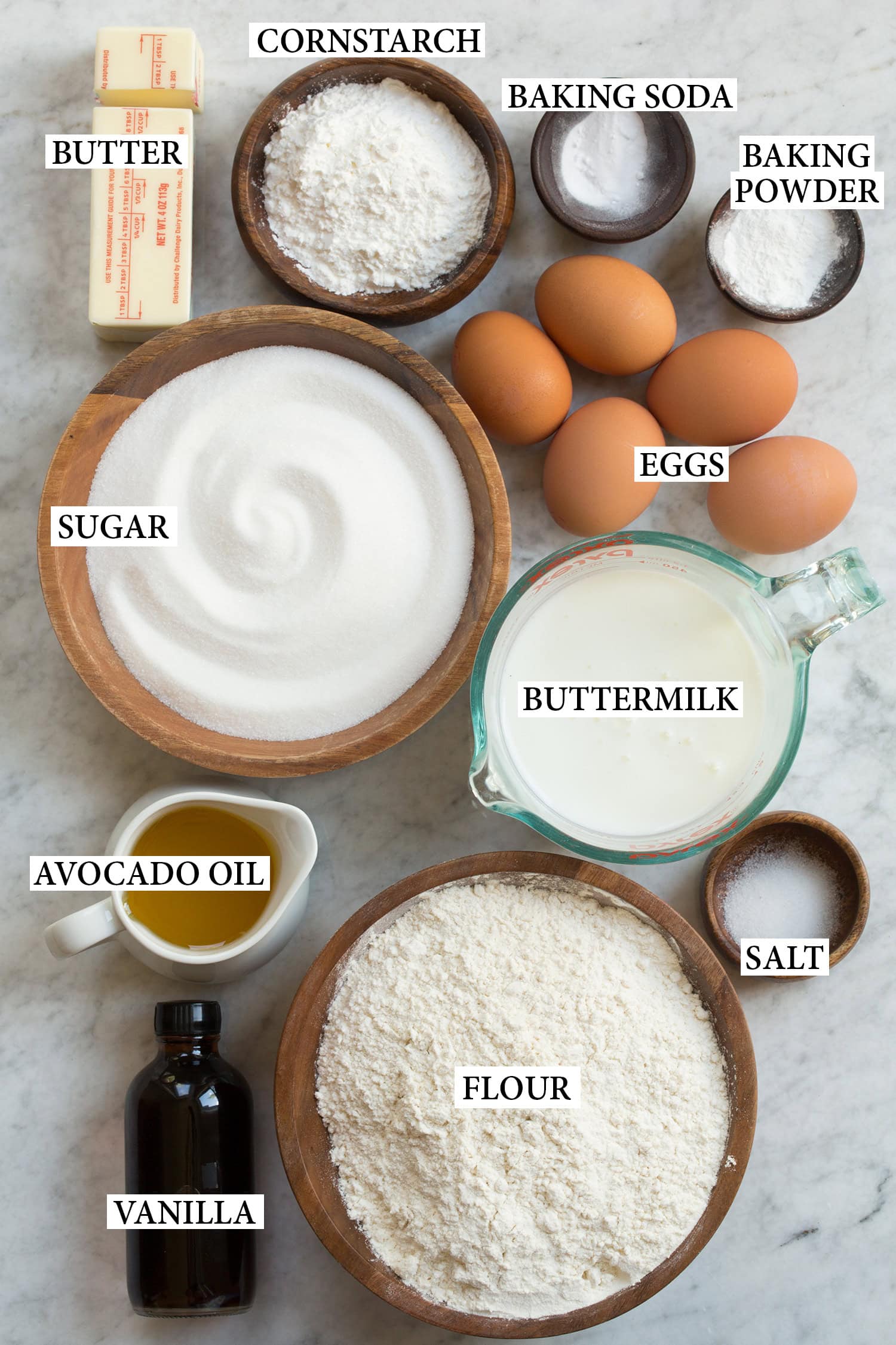 Ingredients used to make a vanilla cake in a sheet pan.