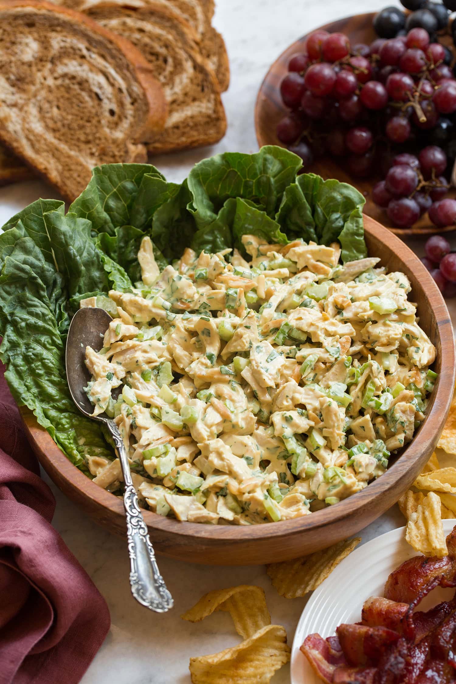 Honey Mustard Chicken Salad Homemade honey mustard chicken salad with celery and almonds in a bowl.