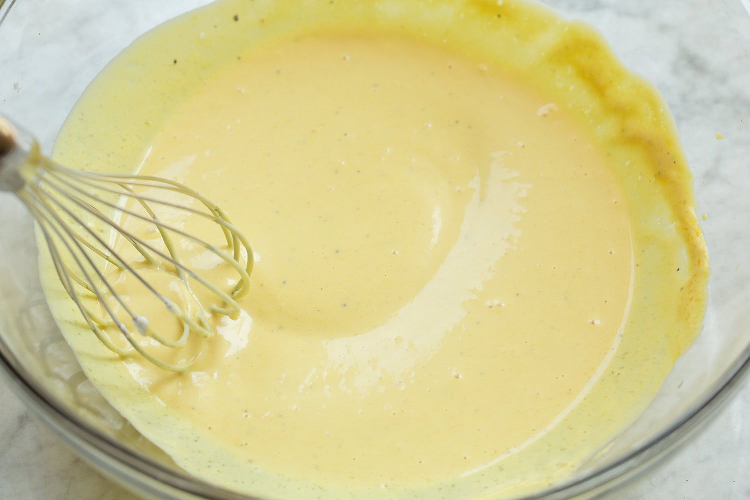 Creamy honey mustard sauce shown after mixing.