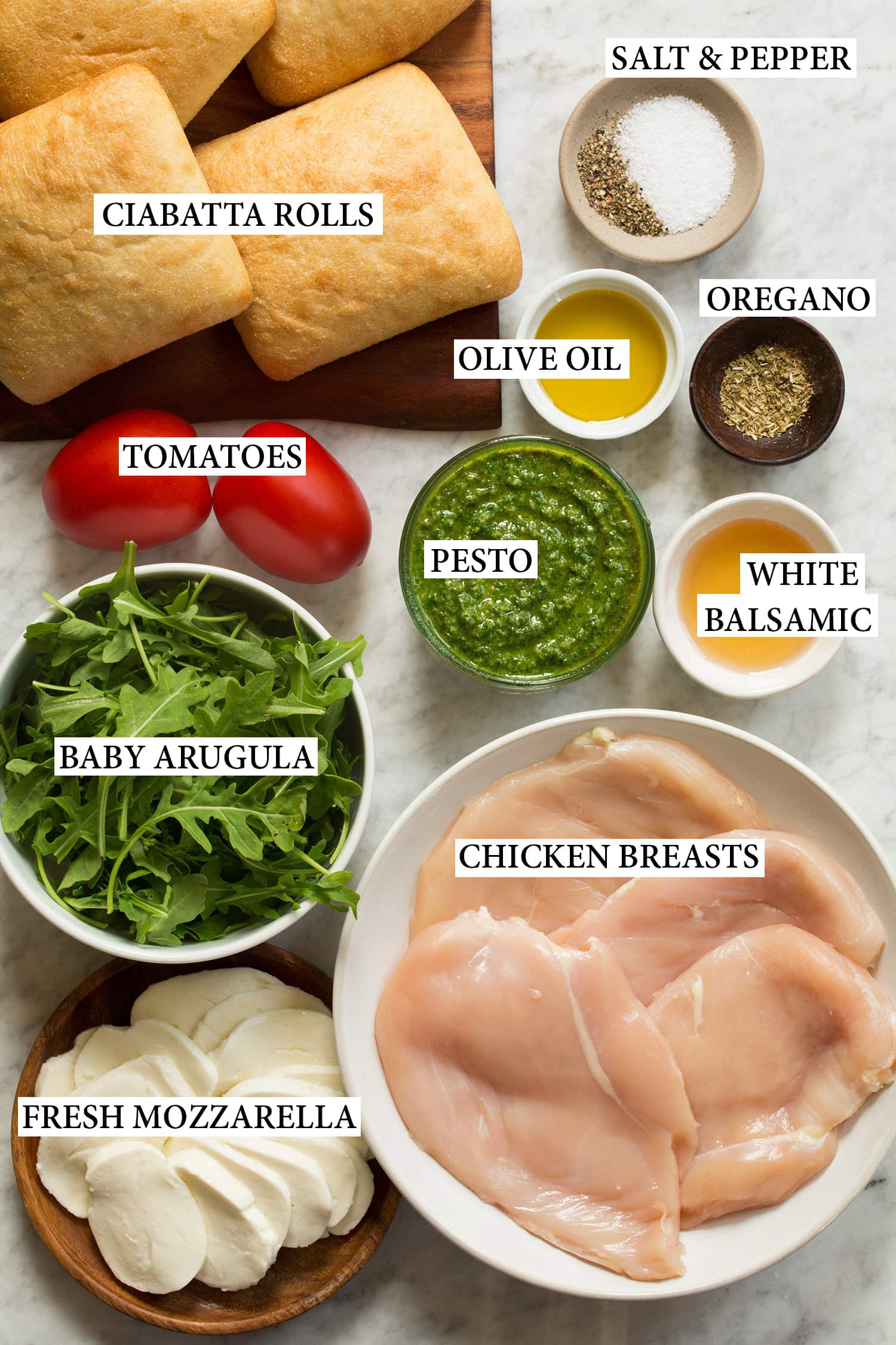 Ingredients used to make a homemade chicken pesto sandwich shown.
