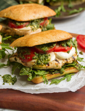 Chicken pesto sandwich on ciabatta bun.