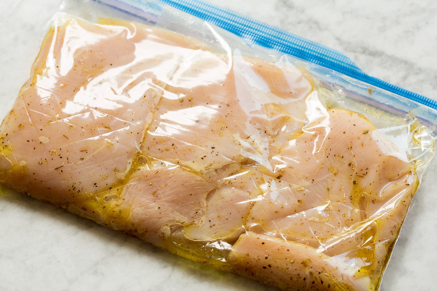 Chicken breasts in an Italian marinade in a bag.