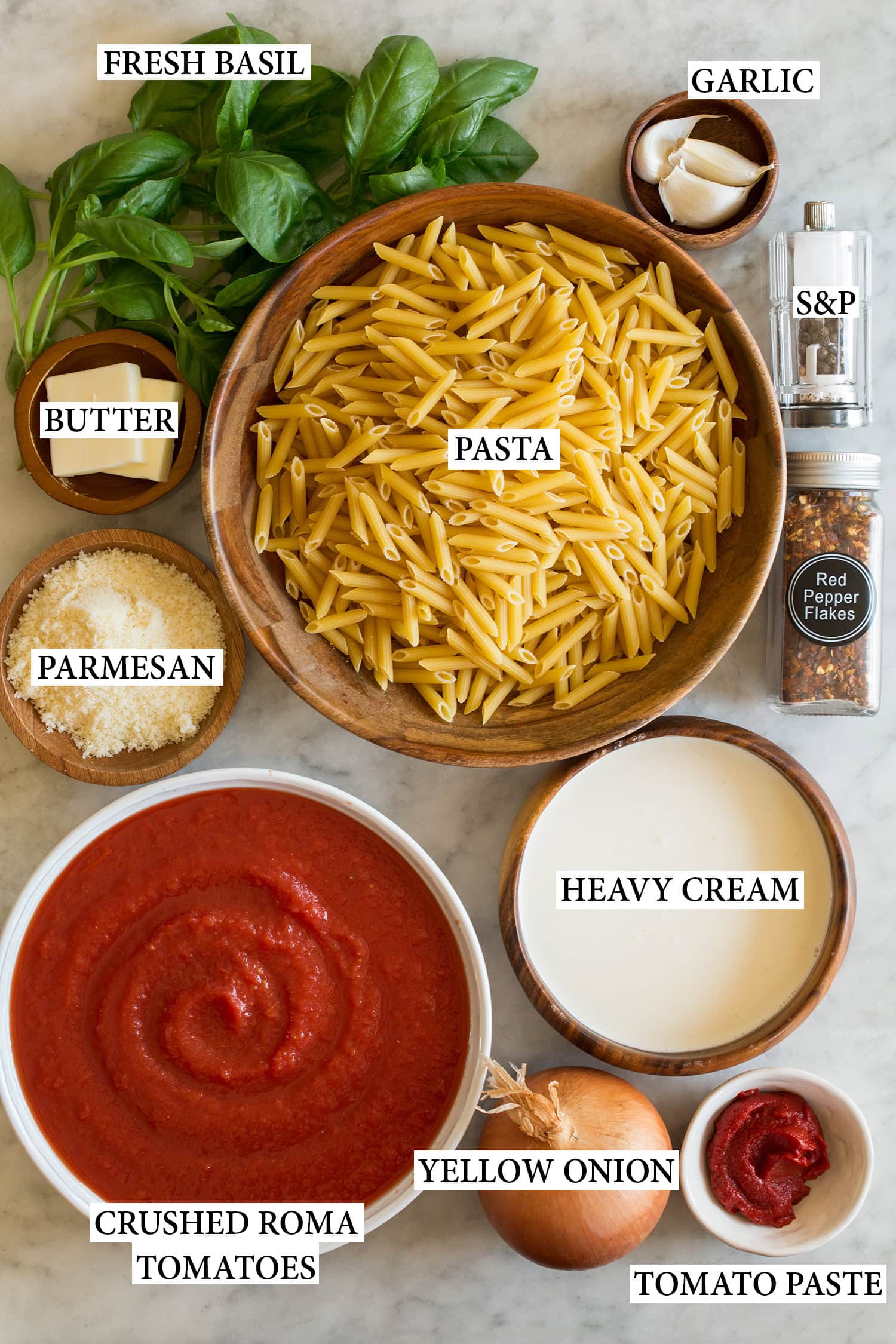 Ingredients used to make creamy tomato pasta.