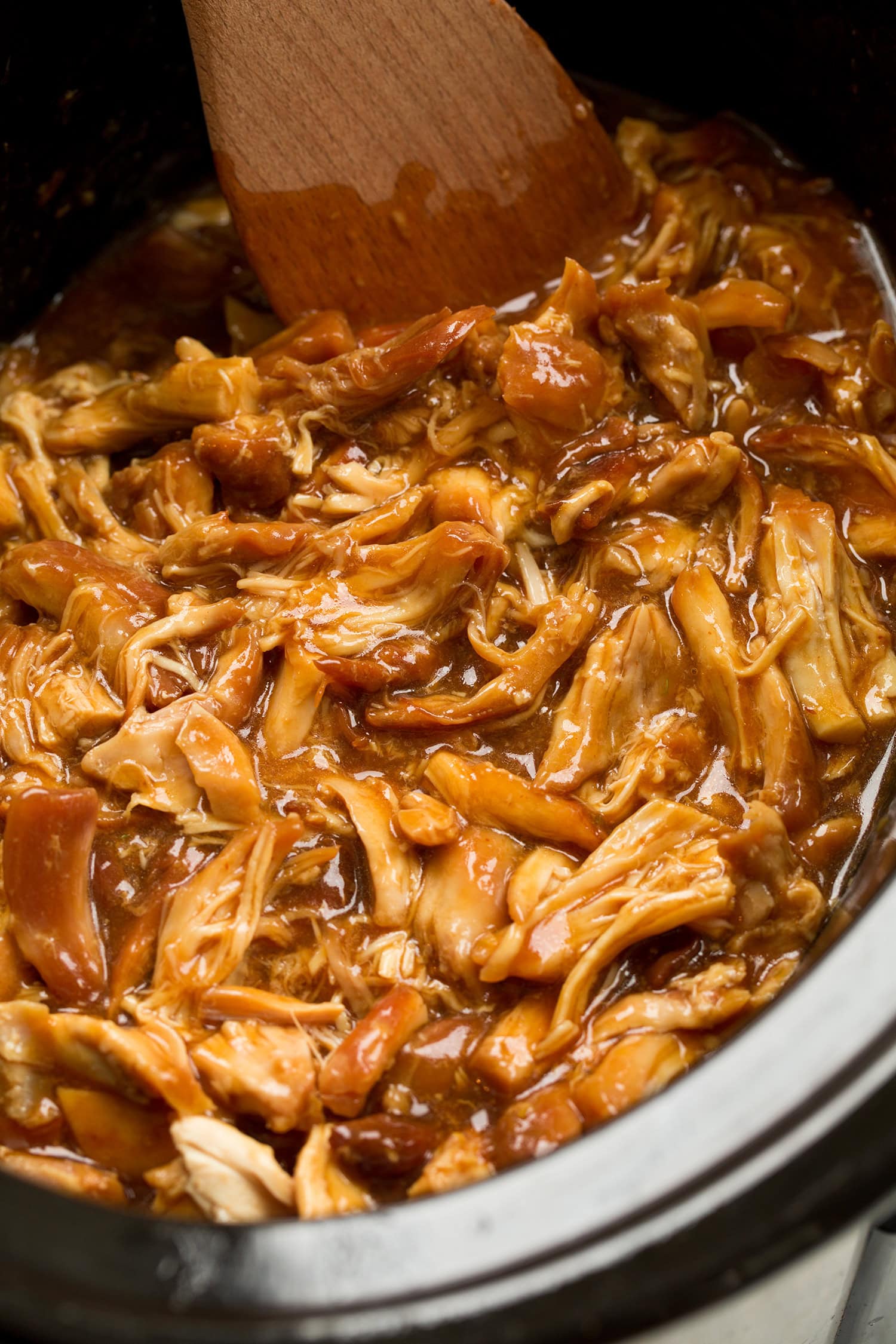 Completed honey garlic chicken in a crockpot.