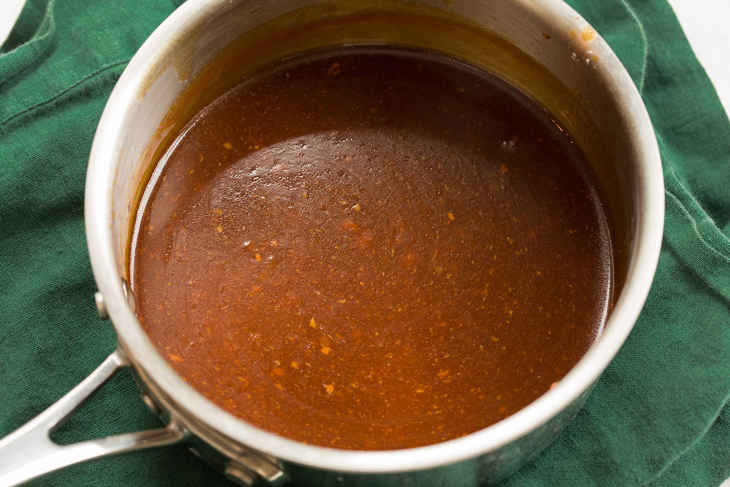 Sauce thickened in a saucepan.